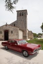 Bordeaux , Aquitaine / France - 11 19 2019 : chevrolet impala red classic american car front old french church Royalty Free Stock Photo