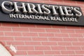 Christies sign and logo text front of real estate luxury store christie`s