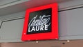 Christine Laure sign light and logo text on shop entrance for fashion clothes brand