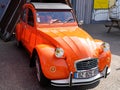 Citroen 2CV sign and brand logo front of retro orange vintage french historical car Royalty Free Stock Photo