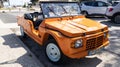 Citroen Mehari ancient beach car orange convertible vehicle in city street in France