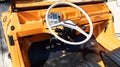 Citroen Mehari interior of beach car orange with steering wheel white and plastic