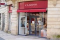 Clarins beauty shop brand logo and text sign on windows entrance store