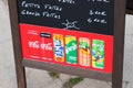 Coca Cola fanta sprite tropico fuze tea sign text and logo on coffee panel front of