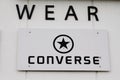 Converse All Star logo and text sign front of shoes shop American shoe store company