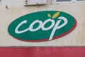 Coop logo brand and text sign facade wall entrance market store cooperative