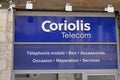 Coriolis Telecom logo sign on panel front of store entrance of french mobile network