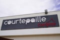 Courtepaille grill brand text and sign logo on entrance restaurant facade wall