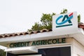 Credit Agricole brand logo ca sign letters text on facade bank agency office