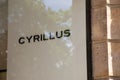 cyrillus logo sign and brand text front wall chain entrance store for Men boys Royalty Free Stock Photo