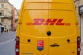DHL logo brand and sign on yellow delivery van car courier closeup rear panel truck