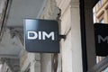 dim sign text and logo brand on wall facade entrance on fashion clothes