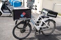 Domino`s pizza logo brand and text sign on delivery bike box bag case for restaurant