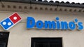 Dominos pizza logo brand and text sign on facade restaurant Domino\'s American