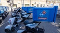 Dominos pizza text sign and brand logo on motorbike topcase of restaurant Domino`s