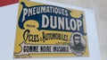 Dunlop brand logo and text sign on advertising car tyres retro vintage adv owned by