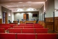 Empty courtroom inside with glass box of accused at french court of justice of