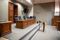 Empty courtroom with judge and clerks workplace courthouse interior justice court Royalty Free Stock Photo