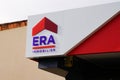 Era home logo and text sign front of real estate office company agency