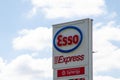 Esso express synergy fuel gas station logo text and brand sign