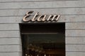 etam logo brand and text sign on wall facade shop entrance in city