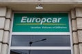 Europcar logo brand and text sign on wall facade entrance agency of rental vehicles