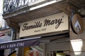 Famille Mary logo text store and brand bee sign on facade entrance boutique beekeeper