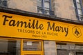 Famille Mary logo text store and brand bee sign on facade wall boutique beekeeper shop