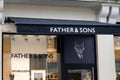 Father & Sons logo text and sign brand front of windows facade store guy clothing