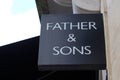 Father & Sons wall facade brand logo text sign on store German luxury fashion for men Royalty Free Stock Photo