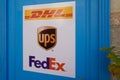 FedEx dhl and ups logo and sign text on wall office shop agency of global courier Royalty Free Stock Photo