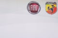 Fiat and Abarth car logo and text sign of dealerships store vehicles seller aside Royalty Free Stock Photo