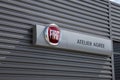 Fiat atelier agree dealership sign text and logo brand of car service station Italian