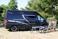 Fiat ducato camper Van black modern motorhome parked in camping area