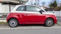 Fiat 500 red white modern car in street side view