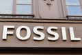 Fossil sign and text logo of store maker of clothing and watches accessories shop for