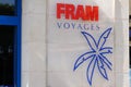 Fram voyages blue palm red logo brand of travel agency with sign shop text front of