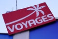 Fram voyages palm red logo of travel brand agency with sign shop text front of store