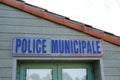 French police municipale sign on outdoor office building wooden wall