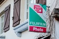 Fujifilm photo brand logo and text sign front of store of Holdings Corporation