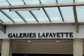 Galeries Lafayette logo brand and text sign wall facade large store global french shop