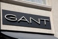 gant logo brand and text sign on wall facade shop entrance in city