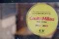Gault & Millau panel yellow badge 2022 logo brand and text sign of famous influential