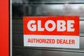 Globe logo brand and text sign authorized dealer store front of fashion clothing