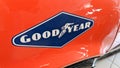 GoodYear tyre logo and text sign on stickers of red racing vintage car Royalty Free Stock Photo