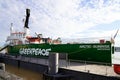 Greenpeace logo and text sign on green boat ship Arctic Sunrise