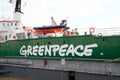 Greenpeace logo and text sign on green ship Arctic Sunrise Royalty Free Stock Photo