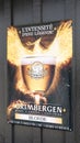 Grimbergen Belgian abbey beers sign text and logo on wall facade advertising panel bar