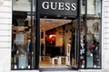 Guess storefront text and logo shop sign of facade store store luxury clothing