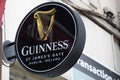 guinness beer sign brand and text logo round on wall facade building restaurant